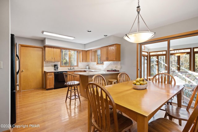 dining space with light wood-style floors