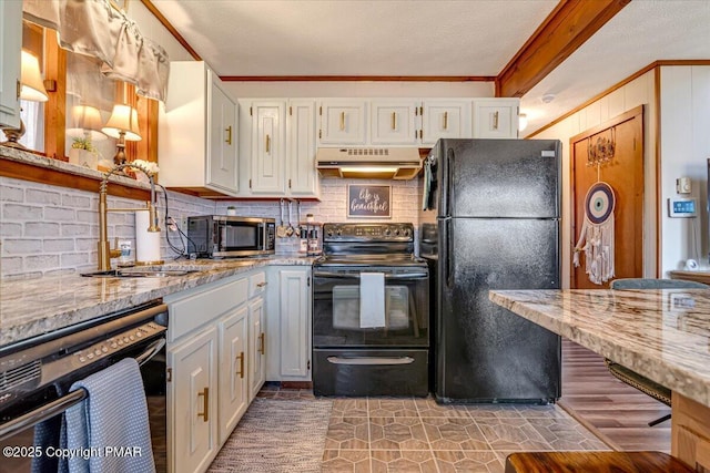 kitchen with a sink, tasteful backsplash, black appliances, under cabinet range hood, and ornamental molding