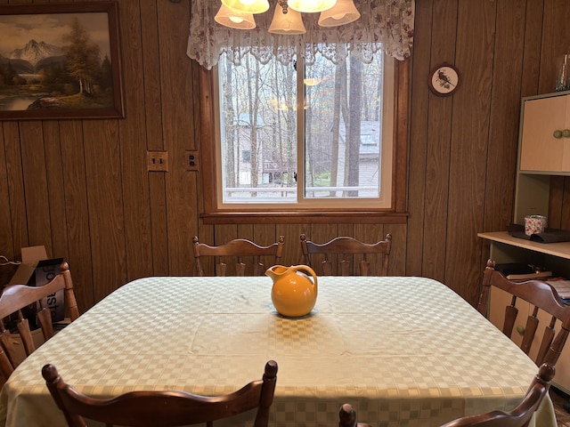 dining area with wood walls