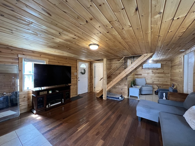 living room with a wall mounted air conditioner, stairway, hardwood / wood-style flooring, wooden walls, and wooden ceiling