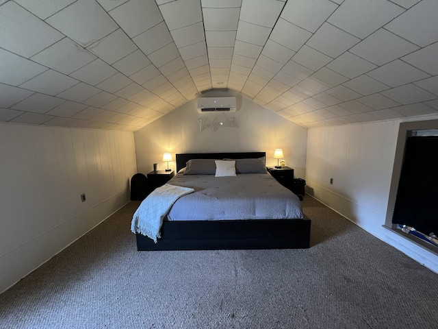 bedroom with vaulted ceiling, carpet, baseboards, and a wall mounted air conditioner