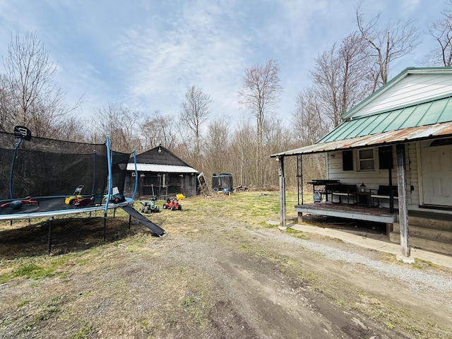 view of yard featuring a trampoline