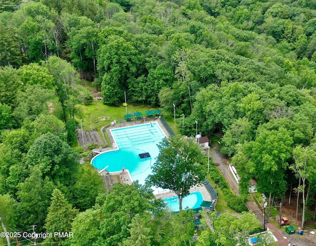 2135 Laurel Rd, Buck Hill Falls, PA 18323 - aerial view of property and surrounding area featuring a pool area and a heavily wooded area