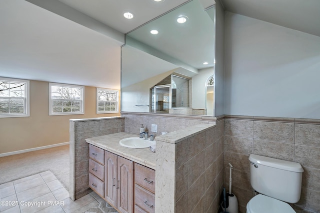 2135 Laurel Rd, Buck Hill Falls, PA 18323 - bathroom featuring tile walls, vanity, toilet, recessed lighting, and tile patterned flooring