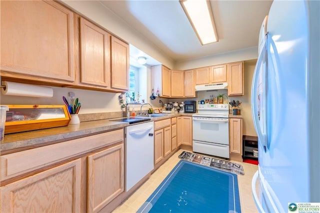 7112 Howell Ter, Stroudsburg, PA 18360 - kitchen with white appliances, light brown cabinets, under cabinet range hood, a sink, and light countertops