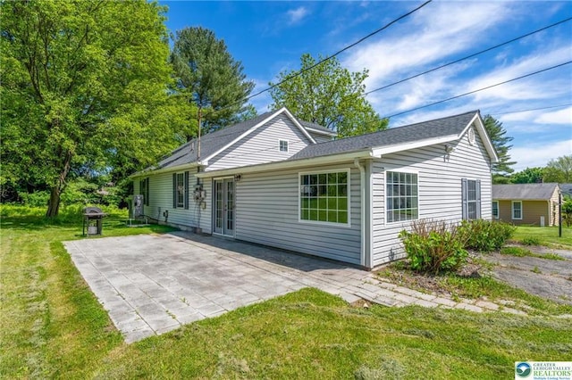 7112 Howell Ter, Stroudsburg, PA 18360 - rear view of property with a yard and a patio area