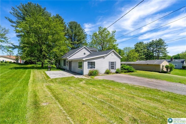 7112 Howell Ter, Stroudsburg, PA 18360 - view of front of house featuring a patio area and a front lawn