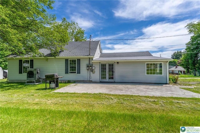 7112 Howell Ter, Stroudsburg, PA 18360 - rear view of house featuring french doors, a patio, a yard, and ac unit