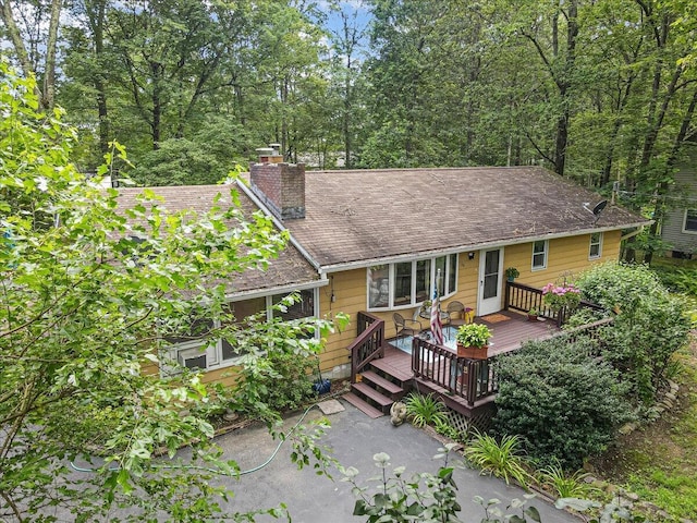 2125 Sassafras Ln, Kunkletown, PA 18058 - view of front of house with a chimney, a deck, and roof with shingles