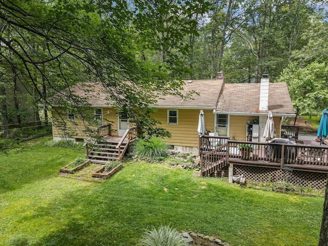 2125 Sassafras Ln, Kunkletown, PA 18058 - back of property with a deck, stairway, and a chimney