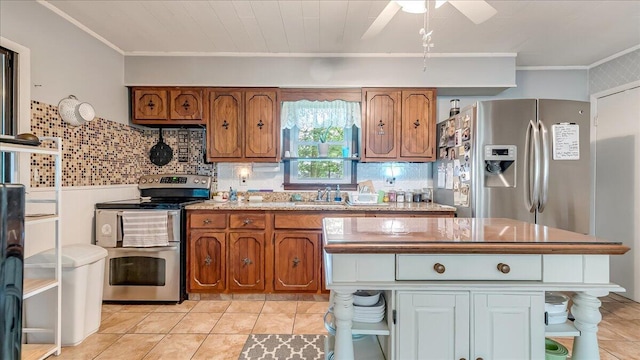2125 Sassafras Ln, Kunkletown, PA 18058 - kitchen with stainless steel appliances, crown molding, brown cabinets, a ceiling fan, and open shelves
