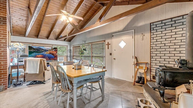 2125 Sassafras Ln, Kunkletown, PA 18058 - dining area with a wood stove, a wooden ceiling with exposed beams, a ceiling fan, high vaulted ceiling, and brick wall
