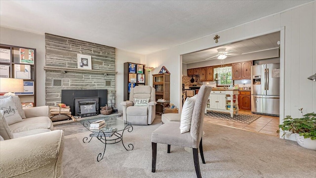 2125 Sassafras Ln, Kunkletown, PA 18058 - living area featuring a ceiling fan, a fireplace, light colored carpet, and light tile patterned flooring