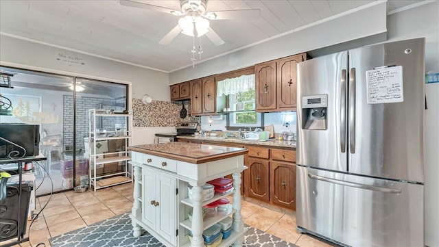2125 Sassafras Ln, Kunkletown, PA 18058 - kitchen with appliances with stainless steel finishes, ornamental molding, light tile patterned flooring, a ceiling fan, and tasteful backsplash