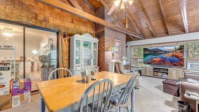 2125 Sassafras Ln, Kunkletown, PA 18058 - carpeted dining space with ceiling fan, a wood ceiling with exposed beams, wooden walls, and high vaulted ceiling