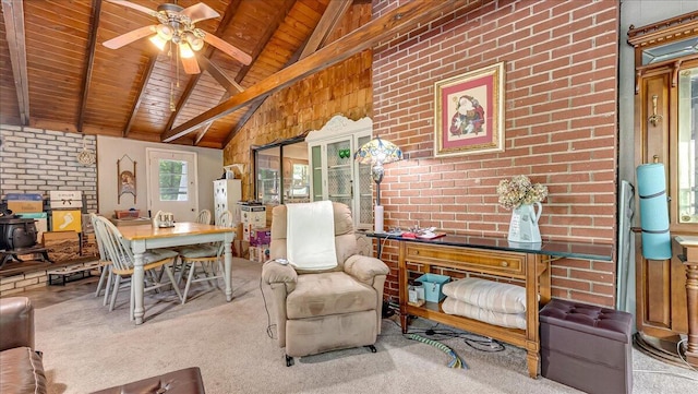 2125 Sassafras Ln, Kunkletown, PA 18058 - carpeted dining room with wooden ceiling, ceiling fan, brick wall, and a wood stove