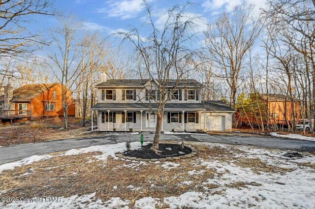 view of front of home featuring a garage and covered porch