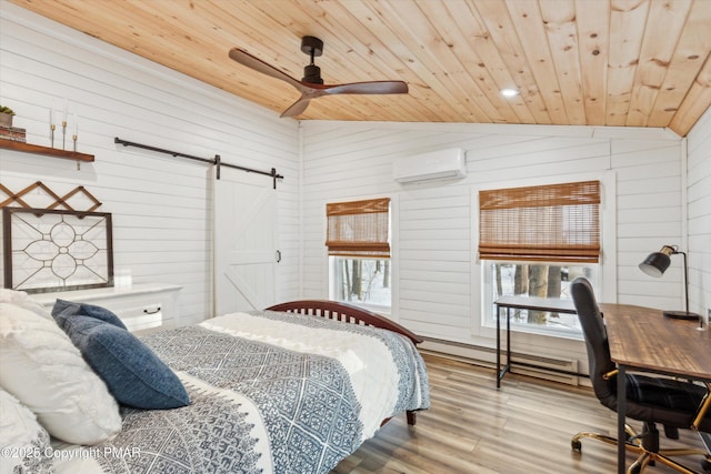 bedroom featuring a baseboard heating unit, wood ceiling, a barn door, lofted ceiling, and a wall unit AC