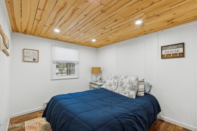 bedroom featuring recessed lighting, wooden ceiling, baseboards, and wood finished floors