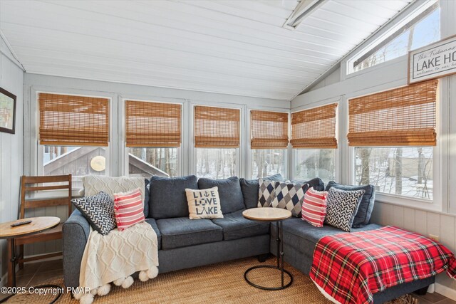 sunroom / solarium with a wealth of natural light and vaulted ceiling