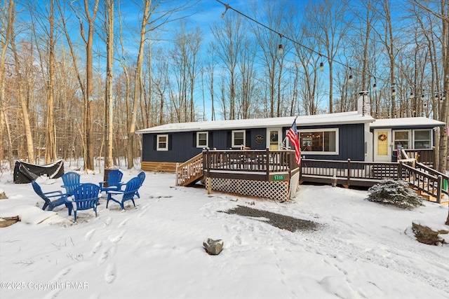 view of front of house featuring a wooden deck