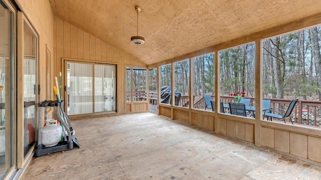 unfurnished sunroom featuring a wealth of natural light and lofted ceiling