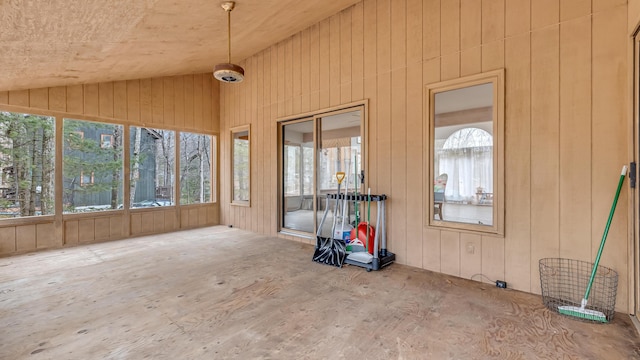 unfurnished sunroom with vaulted ceiling