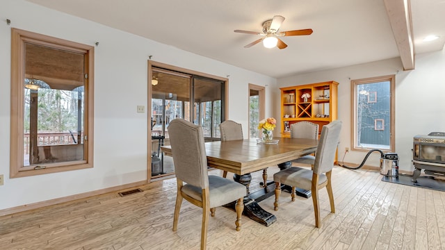 dining space with light wood finished floors, a healthy amount of sunlight, baseboards, and ceiling fan