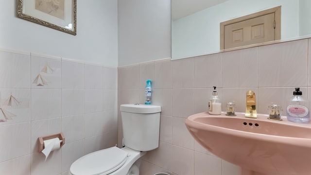 bathroom featuring toilet and a sink