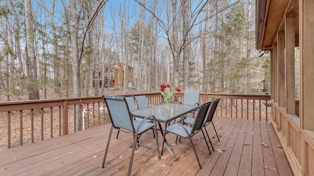 wooden deck featuring outdoor dining space