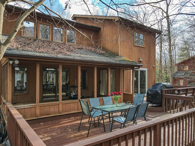 wooden terrace featuring grilling area