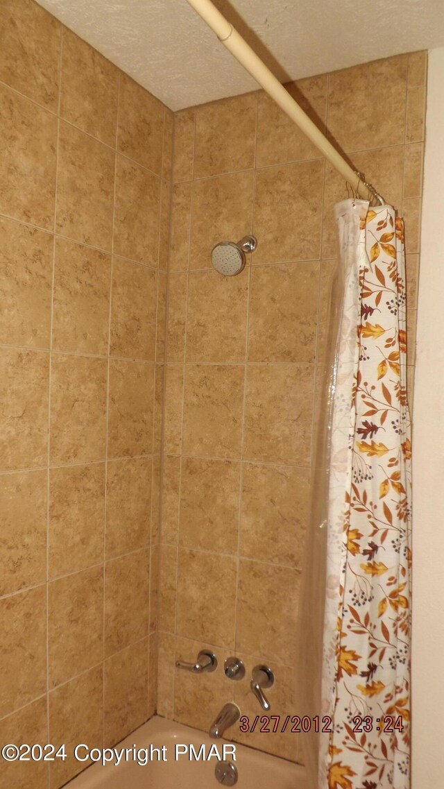 room details with shower / bath combination with curtain