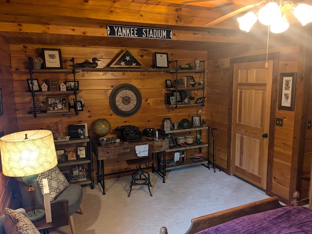 office with wooden walls, ceiling fan, and carpet flooring