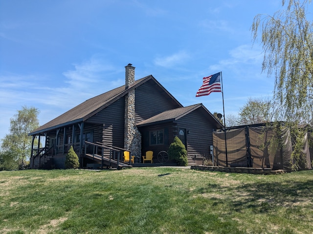 view of side of property with a yard, log veneer siding, a shingled roof, and a chimney