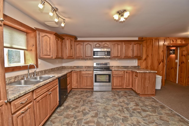 2115 Upper Smith Gap Rd, Saylorsburg, PA 18353 - kitchen featuring appliances with stainless steel finishes, dark stone finish flooring, brown cabinetry, and a peninsula