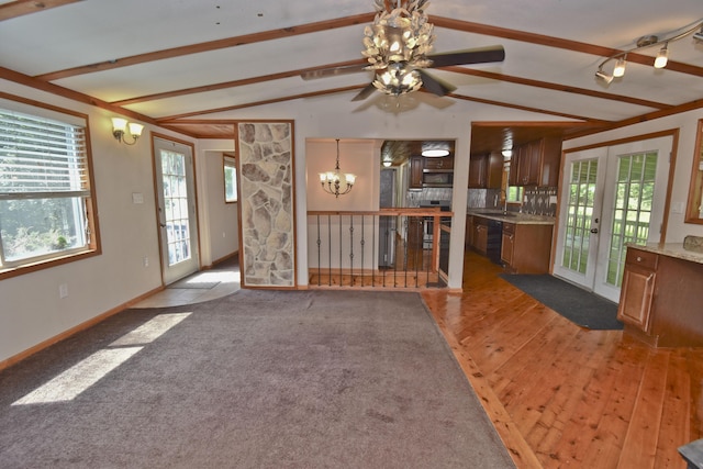 2115 Upper Smith Gap Rd, Saylorsburg, PA 18353 - unfurnished living room featuring a ceiling fan, french doors, light wood-type flooring, and a chandelier
