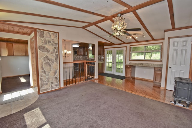 2115 Upper Smith Gap Rd, Saylorsburg, PA 18353 - unfurnished living room featuring a chandelier, a wood stove, french doors, and ceiling fan
