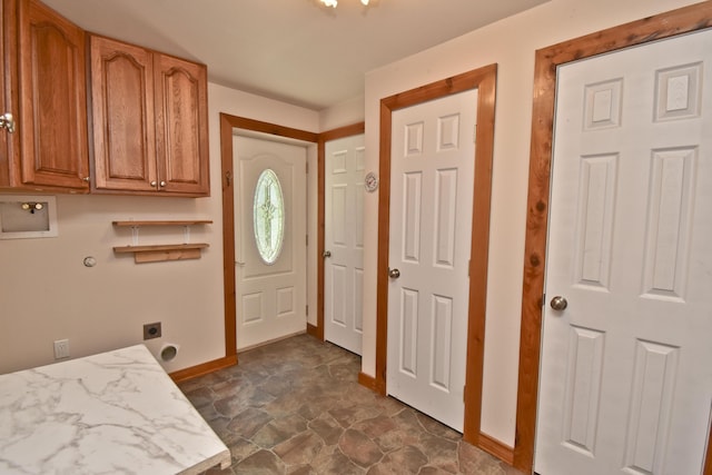2115 Upper Smith Gap Rd, Saylorsburg, PA 18353 - laundry room featuring hookup for an electric dryer, cabinet space, washer hookup, and dark stone finish floors