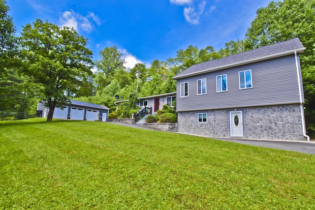 2115 Upper Smith Gap Rd, Saylorsburg, PA 18353 - view of front of property featuring a front yard, a garage, and stone siding