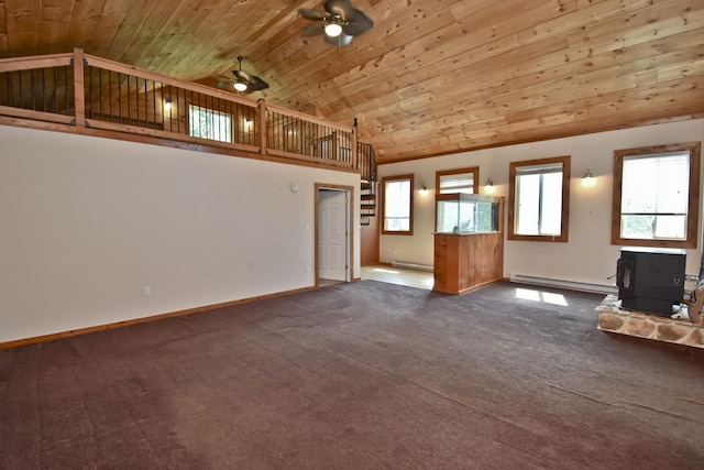 2115 Upper Smith Gap Rd, Saylorsburg, PA 18353 - unfurnished living room featuring wood ceiling, a baseboard heating unit, a wood stove, a ceiling fan, and dark colored carpet