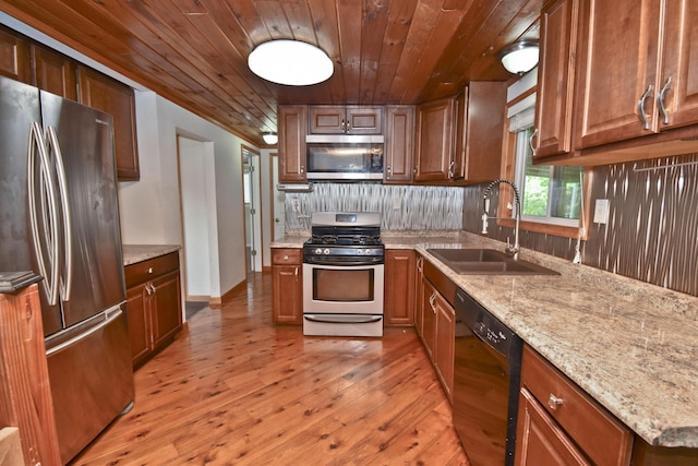 2115 Upper Smith Gap Rd, Saylorsburg, PA 18353 - kitchen with appliances with stainless steel finishes, wooden ceiling, light wood-type flooring, decorative backsplash, and light stone counters