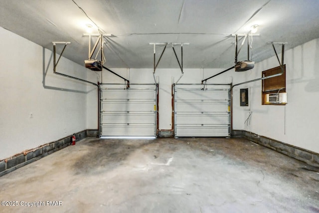 garage featuring cooling unit and a garage door opener