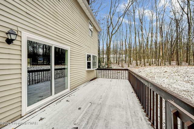 view of snow covered deck