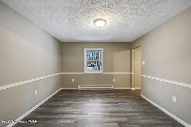 unfurnished room with a baseboard heating unit, a textured ceiling, baseboards, and wood finished floors