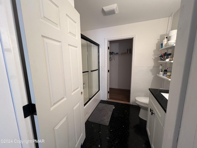 full bathroom featuring toilet and vanity