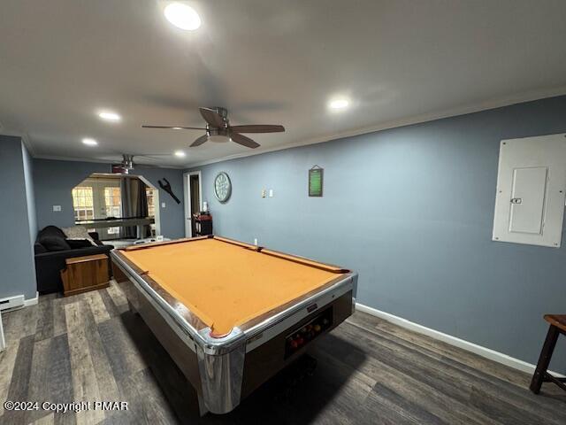 rec room featuring ornamental molding, electric panel, baseboards, and dark wood-style floors