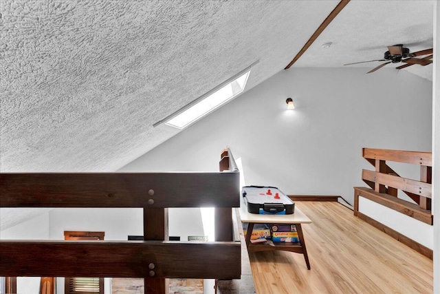 99 Ruffed Grouse Ct, Lake Harmony, PA 18624 - bonus room with vaulted ceiling, a skylight, a textured ceiling, light wood finished floors, and a ceiling fan