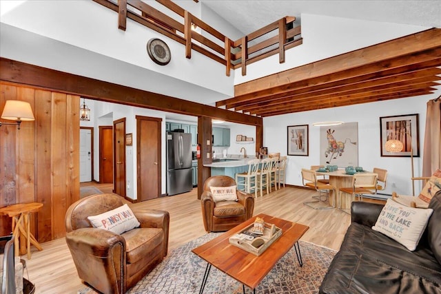 99 Ruffed Grouse Ct, Lake Harmony, PA 18624 - living area featuring light wood-type flooring and beam ceiling