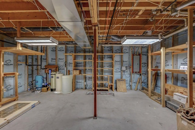 14 E Point Rd, Albrightsville, PA 18210 - unfinished basement with electric panel, a water softener, and a water pressure tank