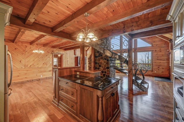 14 E Point Rd, Albrightsville, PA 18210 - kitchen featuring a chandelier, wood walls, wooden ceiling, appliances with stainless steel finishes, and wood-type flooring